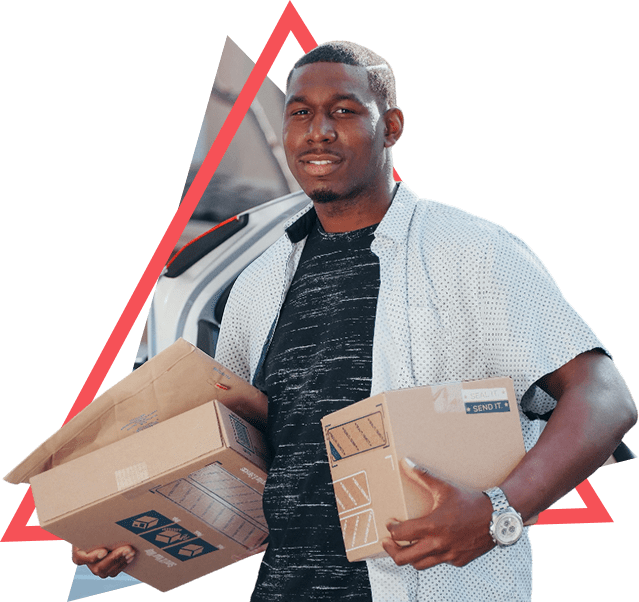 A man holding boxes in his hands.